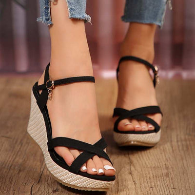 Women's black open-toe wedge sandals with cross buckle and hemp rope detailing.